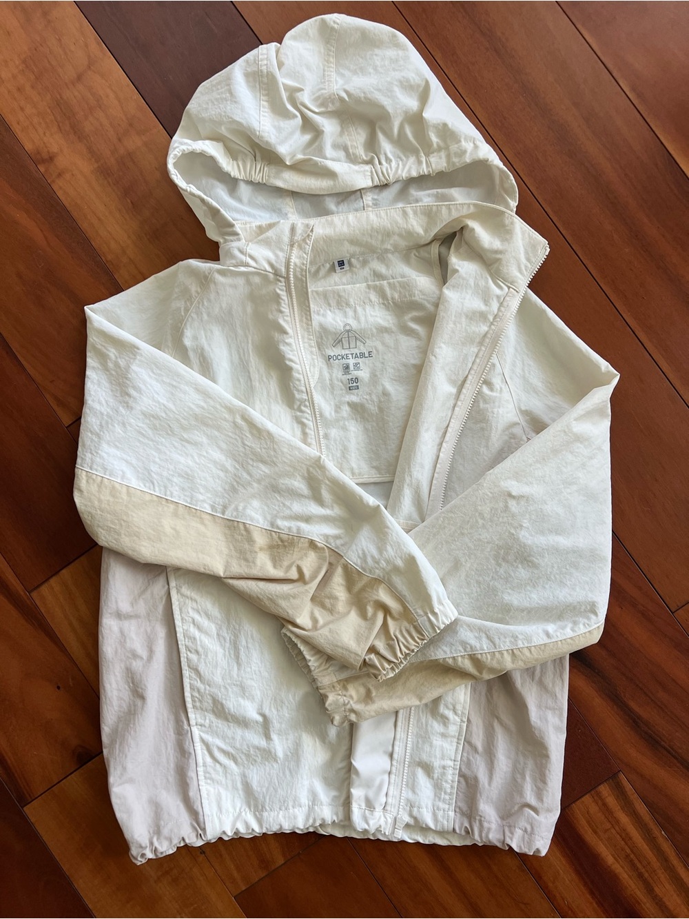 Uniqlo Kids Hooded Raincoat in Cream and White